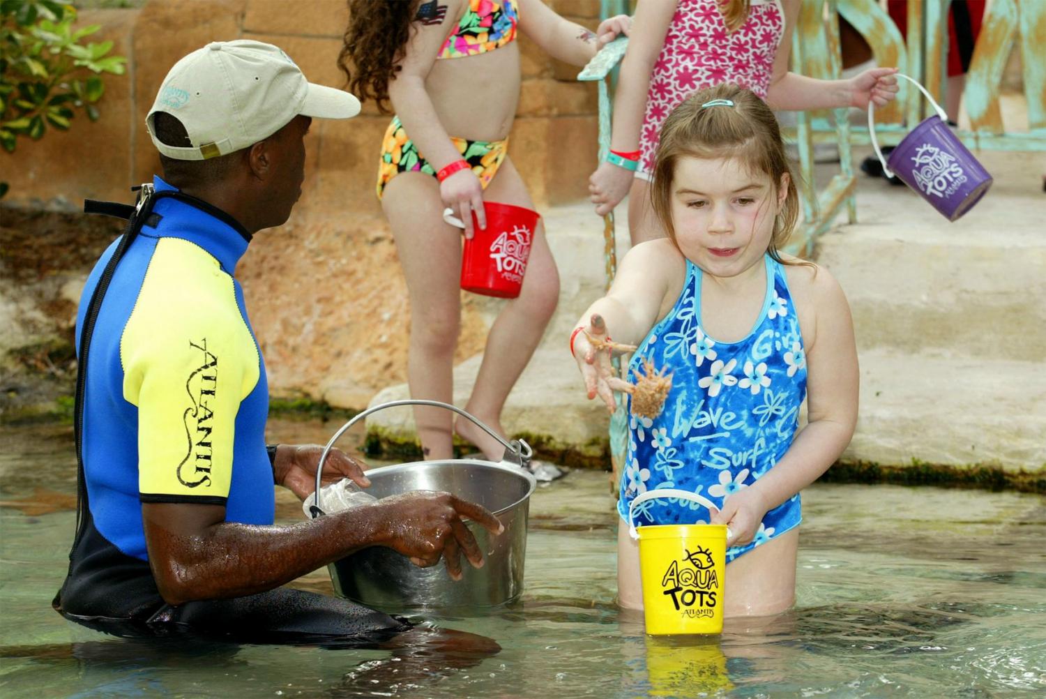 Kids Feeding Fish